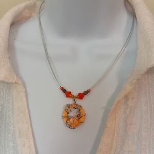 Elegant Orange Swirl Pendant Necklace
